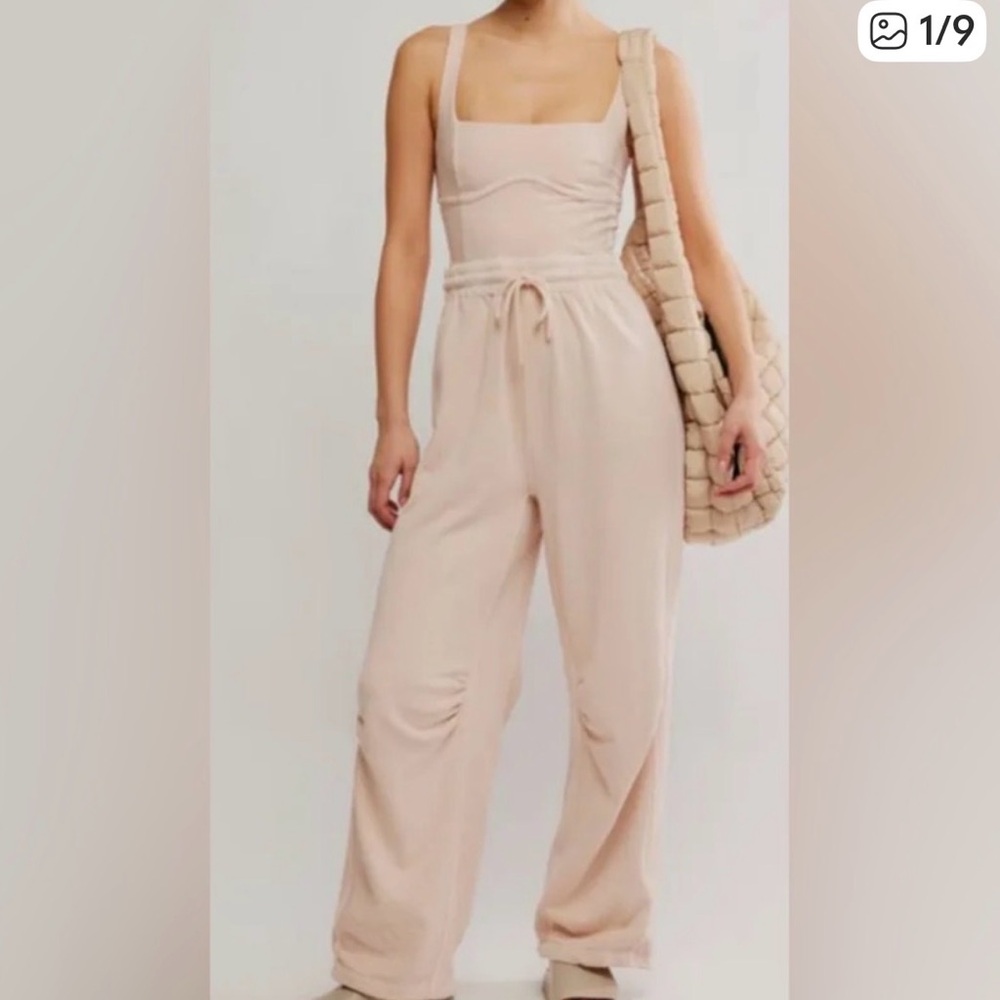 Free people movement light pink inbound onesie